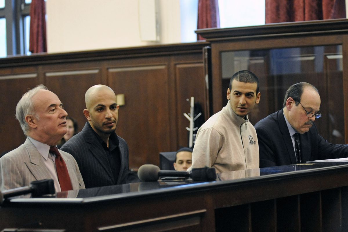 Ahmed Ferhani 26, second from left, and Mohamed Mamadouh, 20, second from right, appear in court with their attorneys for arraignment on Thursday in New York. Both men are charged with a terrorist plot targeting New York synagogues. (Associated Press)