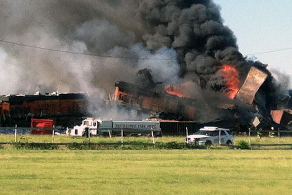 In this photo provided by Billy B. Brown, two freight trains are on fire Tuesday, June 28, 2016, after they collided and derailed near Panhandle, Texas. Texas Department of Public Safety Lt. Bryan Witt says the accident occurred Tuesday morning near the town of Panhandle, about 25 miles northeast of Amarillo. No injuries have been reported. (Billy B. Brown / Associated Press)