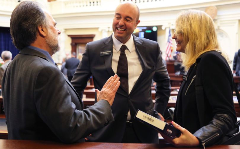 House Education Committee Chairman Reed Demordaunt talks with Reps. Vito Barbieri and Wendy Horman. (Idaho Education News/photo)