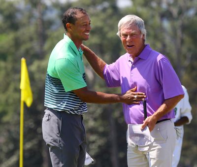 Tiger Woods, left, and Ben Crenshaw teamed Wednesday for a practice round for the Masters golf tournament. (Associated Press)