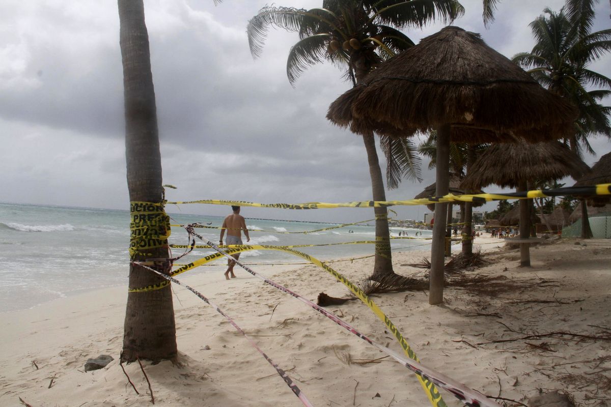 Tape closing off the beach blows in the wind before the arrival of Tropical Storm Zeta in Playa del Carmen, Mexico, Monday, Oct. 26, 2020. A strengthening Tropical Storm Zeta is expected to become a hurricane Monday as it heads toward the eastern end of Mexico