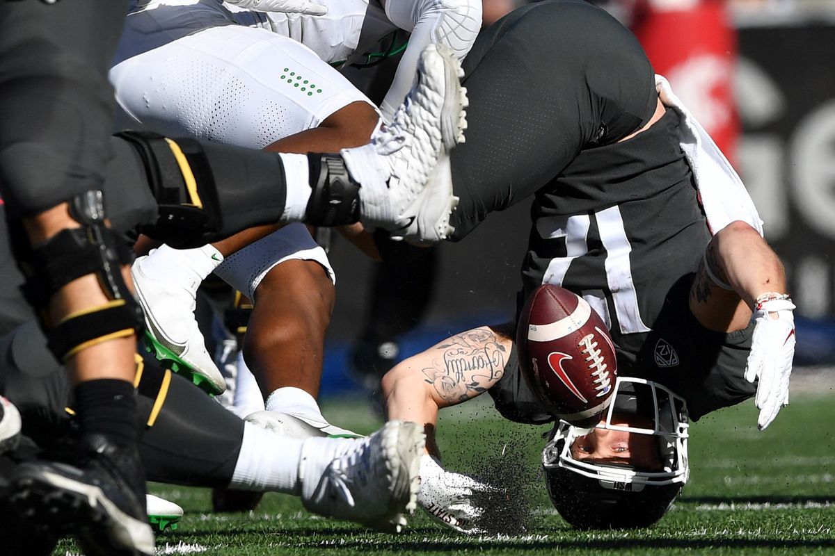 Washington State Cougars wide receiver Robert Ferrel (12) flips upside down on a run against Oregon during the second half of a college football on Saturday , Sept. 24, 2022, at Martin Stadium in Pullman, Wash. Oregon won the game 44-41.  (Tyler Tjomsland/The Spokesman-Review)