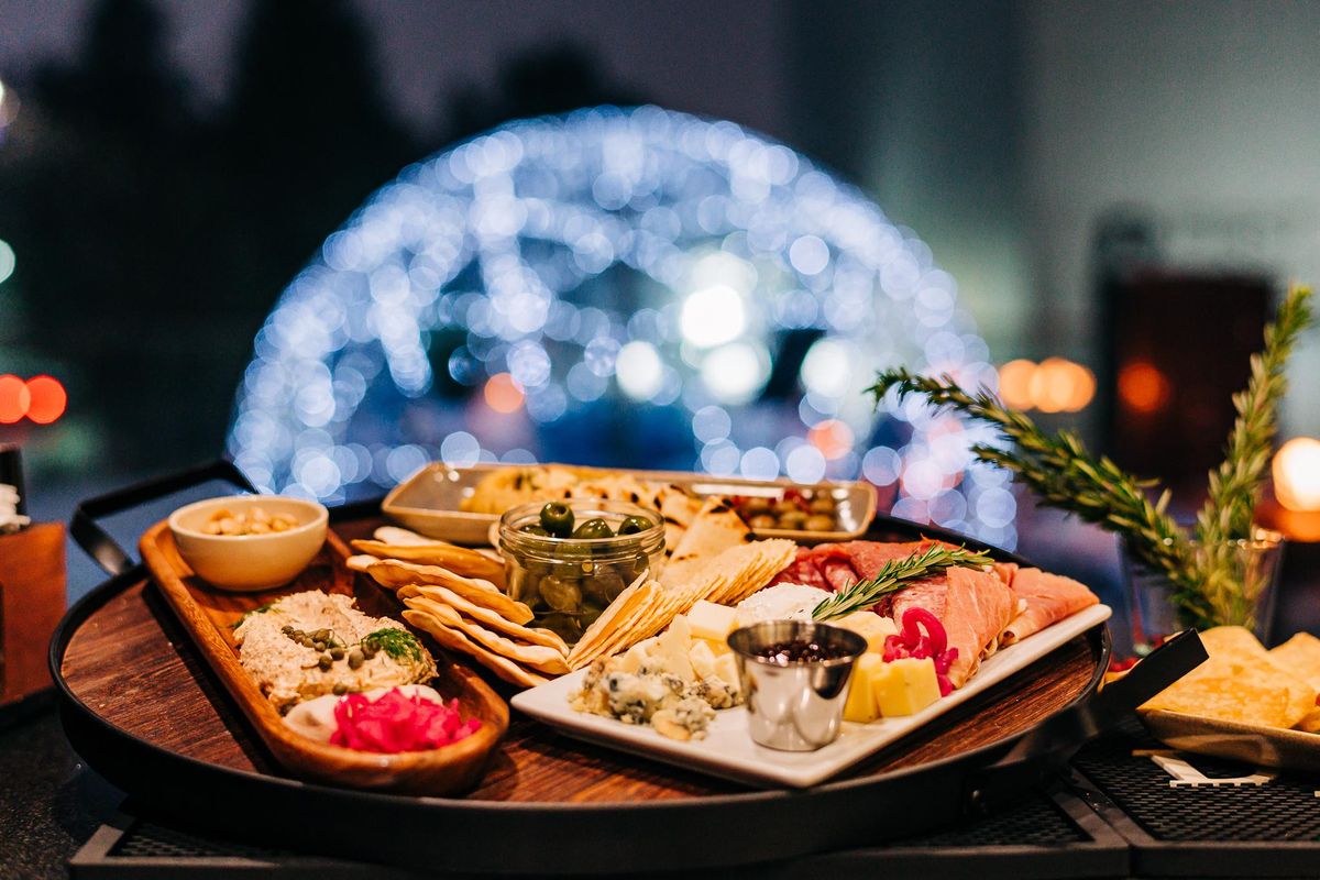 The grand igloo package, for $250 and as many as six guests on the Davenport Grand’s second-floor terrace, includes snacks such as Castelvetrano olives, Marcona almonds, antipasto (meats, cheeses and pickled vegetables), house-smoked garlic hummus and pita. (Davenport Hotels)