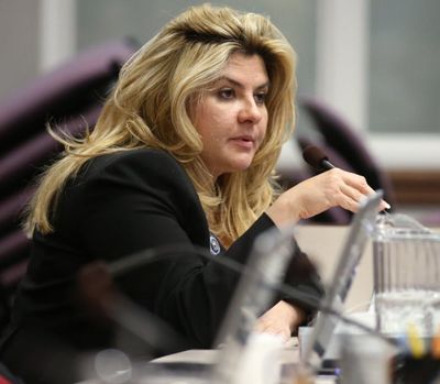 In a Monday, June 3, 2013, file photo, Nevada Assemblywoman Michelle Fiore, R-Las Vegas, works in committee during the final day of the 77th Legislative session at the Legislative Building in Carson City, Nev. Fiore spoke Wednesday to some of the four occupiers of a national wildlife refuge in Oregon. As David Fry and Sean Anderson yelled back and forth with the FBI, Fiore spoke to them and Sandy Anderson on a phone, telling them she could only help them if they stayed alive. (AP Photo/Cathleen Allison, File) 