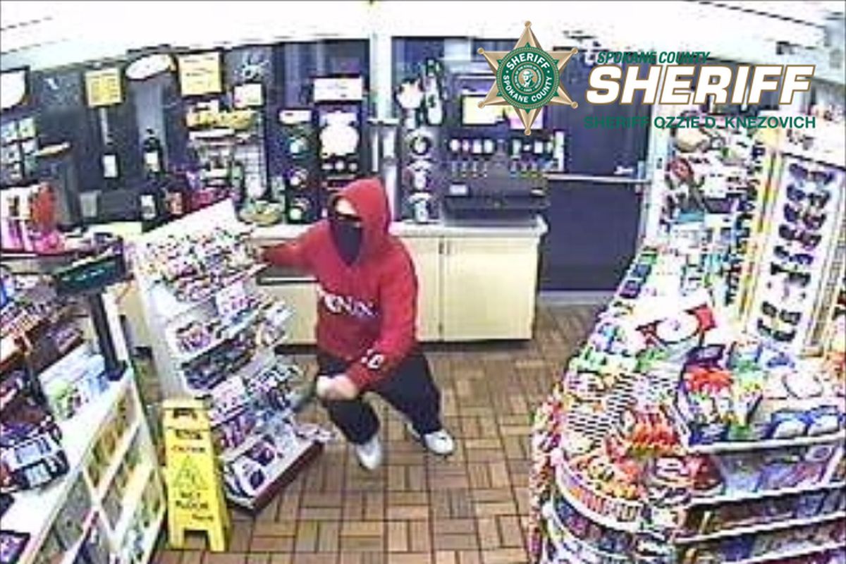 A man flees the scene of a robbery at a Spokane Valley convenience store shortly before 1 a.m. Thursday, Sept. 26, 2013. Spokane County Sheriff