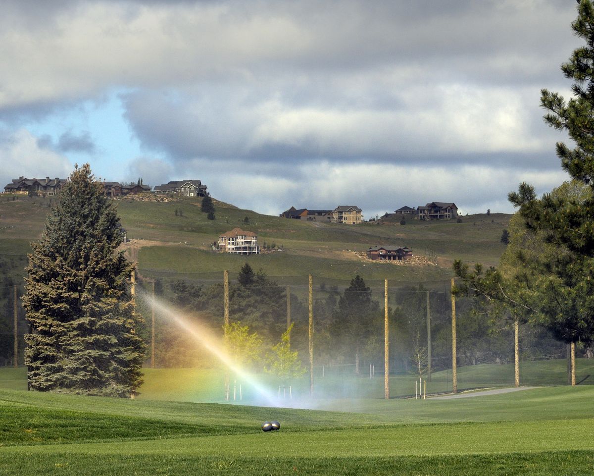 A sprinkler creates a rainbow on the fairway of the newly renovated Liberty Lake Golf Course on Thursday, May 20, 2010. In this area, crews found an area filled with sand possibly deposited from the great Missoula flood. (Christopher Anderson / The Spokesman-Review)
