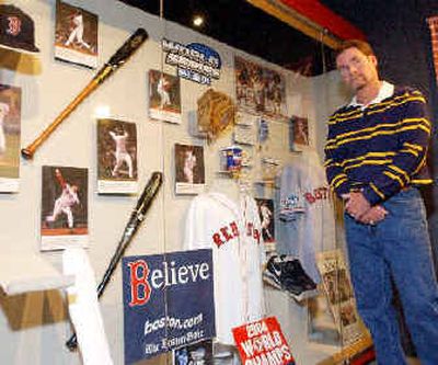 
New baseball Hall of Fame inductee Wade Boggs poses Tuesday next to an exhibit about the 2004 World Series won by the Boston Red Sox, one of his former teams. 
 (Associated Press / The Spokesman-Review)