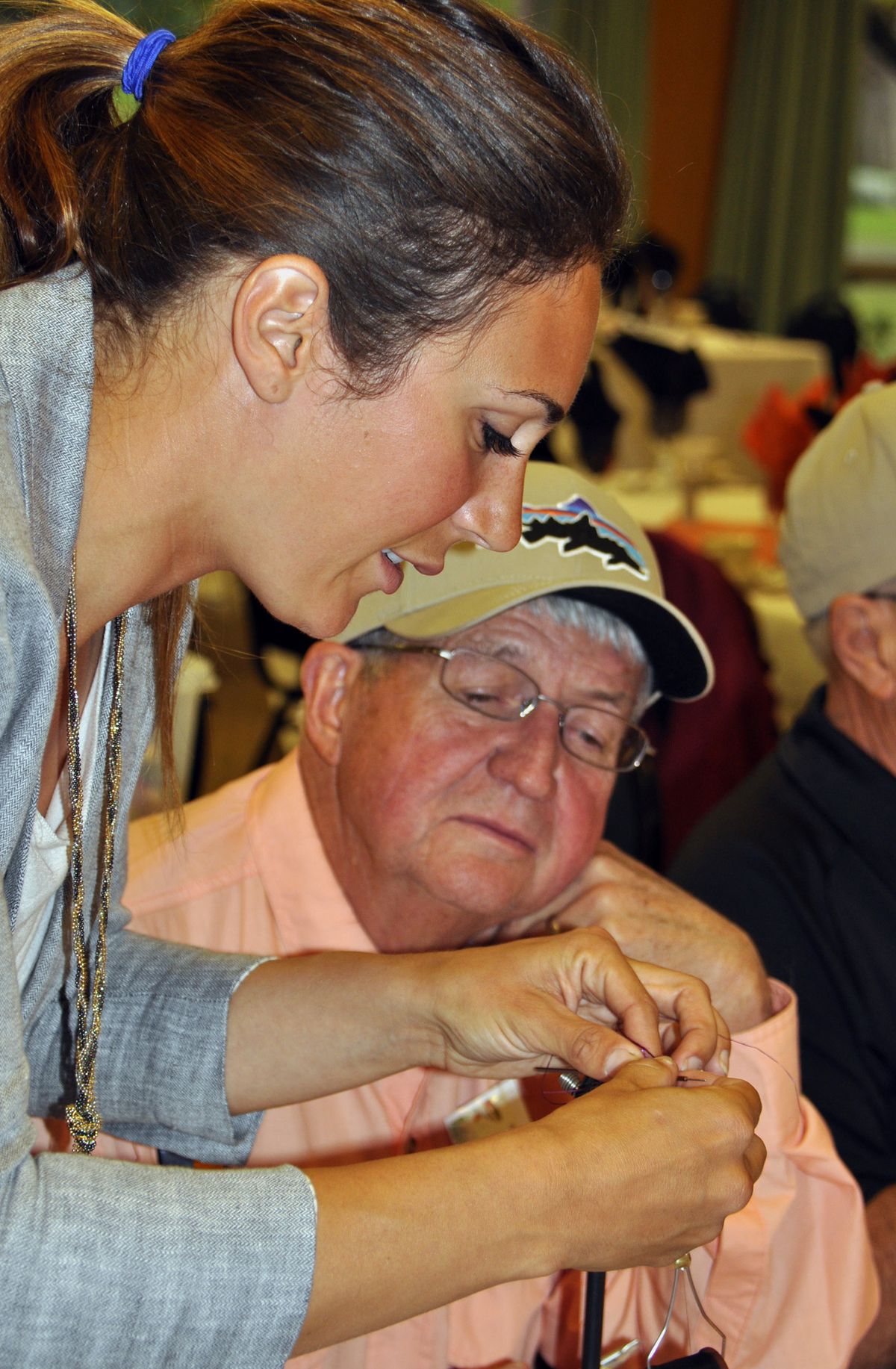 April Vokey shows fly-tying techniques to Neal Beechinor of the Inland Empire Fly Fishing Club. (Rich Landers)