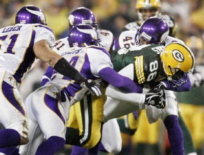 
It takes a horde of Vikings to put a stop to Packers tight end Bubba Franks after he caught a pass. 
 (Associated Press / The Spokesman-Review)