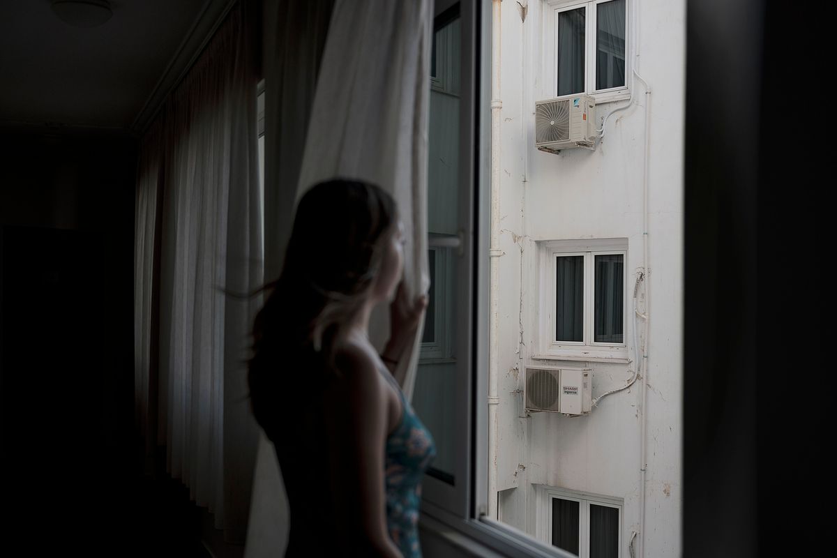 Air-conditioning units hang in the lightwell that runs through the center of the Hotel Attalos, run by Melina Zisi and her family in Athens. MUST CREDIT: Photo by Myrto Papadopoulos for The Washington Post.  (Myrto Papadopoulos/For The Washington Post)