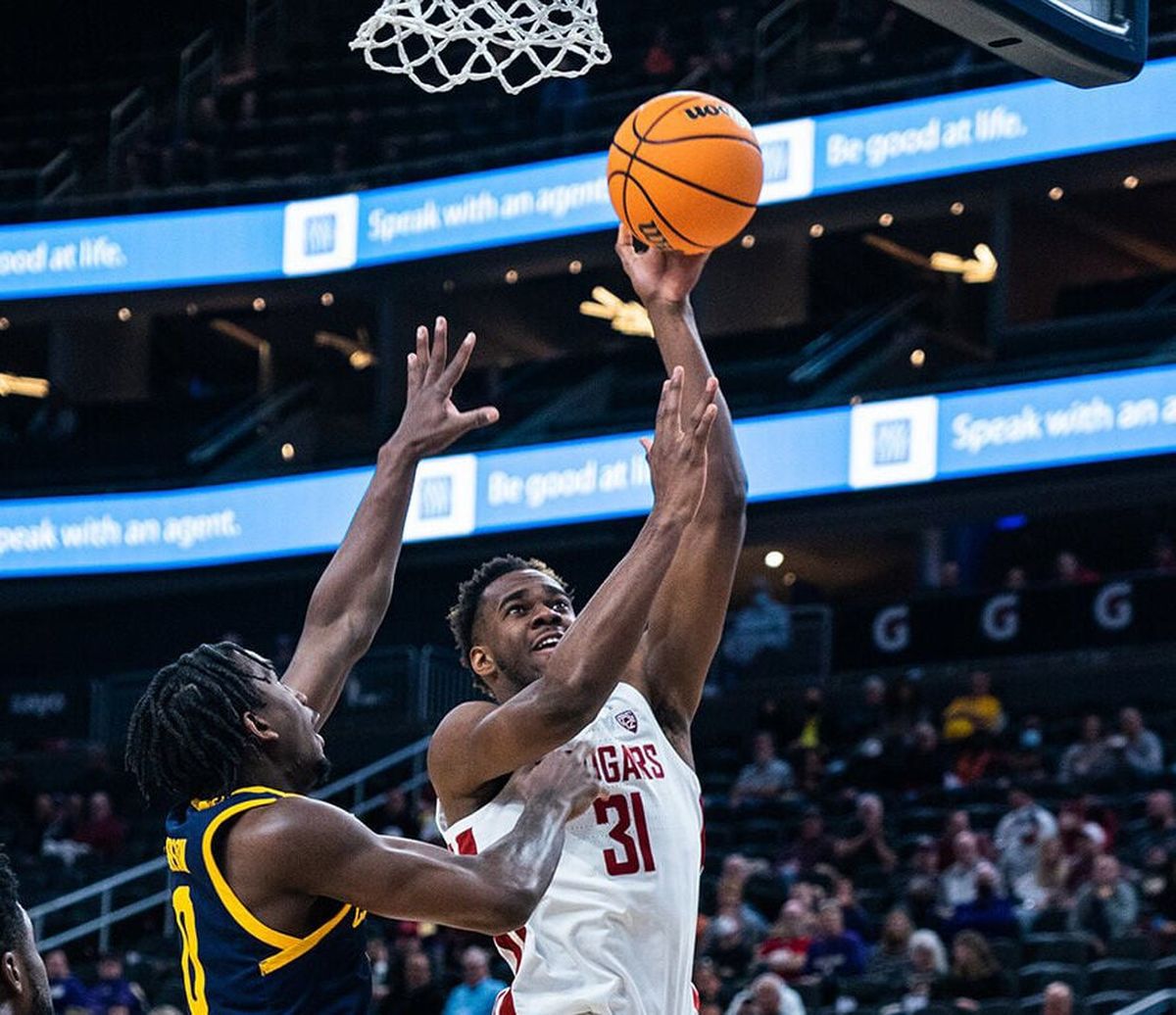 Washington State guard Kymany Houinsou goes up for a shot against California guard Marsalis Roberson during a Pac-12 Tournament game at T-Mobile Arena in Las Vegas on Wednesday.  (Courtesy of Pac-12 Conference)