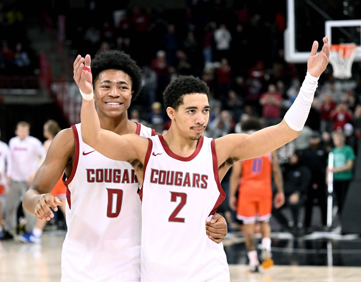 Washington State’s Jaylen Wells, left, and Myles Rice celebrate the Cougars’ 66-61 win over Boise State on Dec. 21 at the Arena.  (COLIN MULVANY/THE SPOKESMAN-REVIEW)