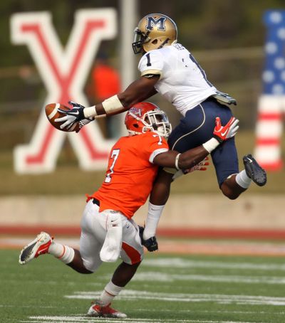 Montana State’s Elvis Akpla, right, makes the reception against Daxton Swanson. (Associated Press)