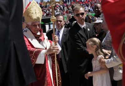 
Pope Benedict XVI walks down the center aisle after celebrating Mass at Nationals Park in Washington on Thursday. Associated Press
 (Associated Press / The Spokesman-Review)