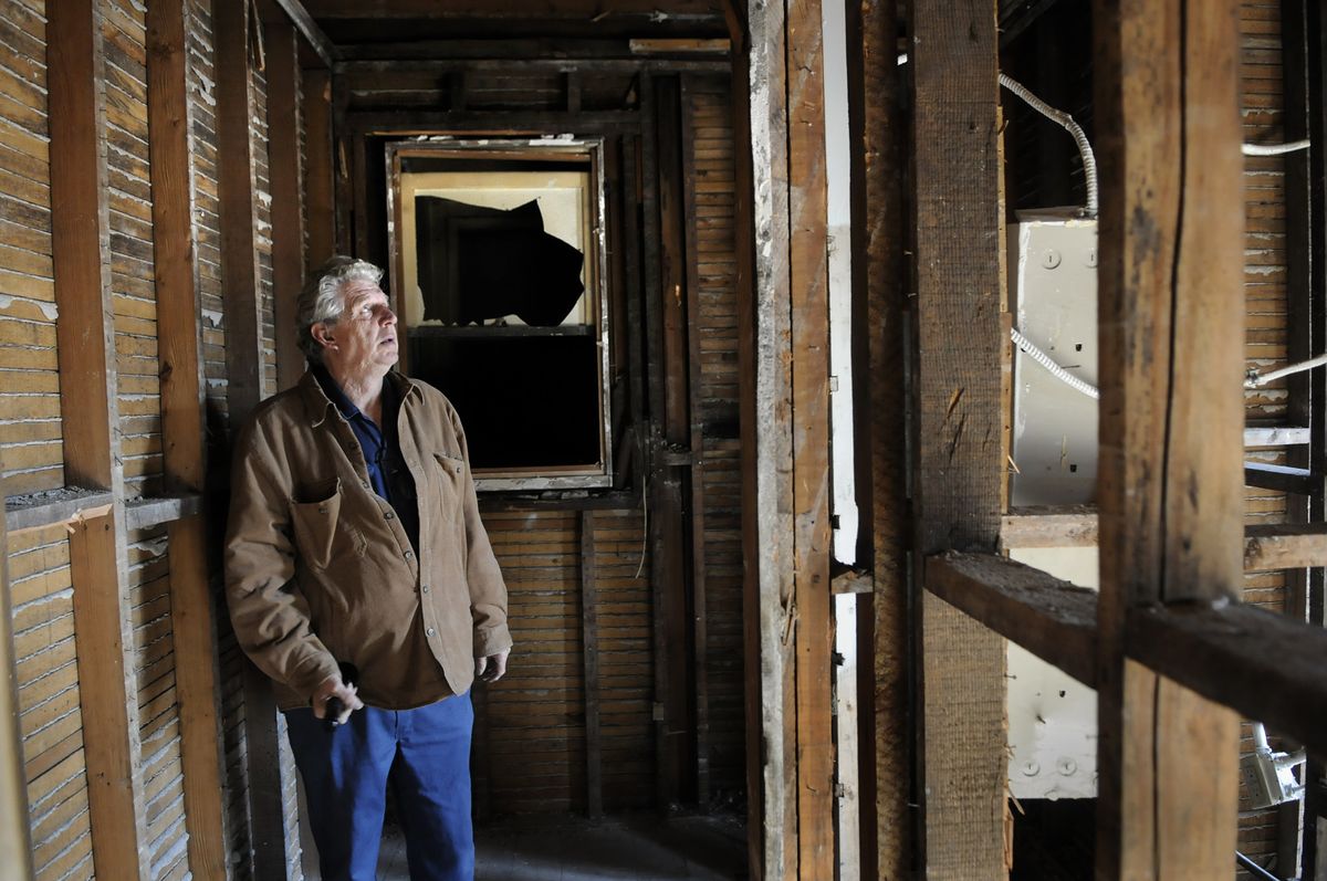 Northeast Washington Housing Solutions maintenance manager Carl Couture views a gutted room at the Helen Apartments on South Adams Street in Spokane.  Housing Solutions  plans to update the building and rename it the Pearl, with units priced for low-income residents.  (Dan Pelle / The Spokesman-Review)