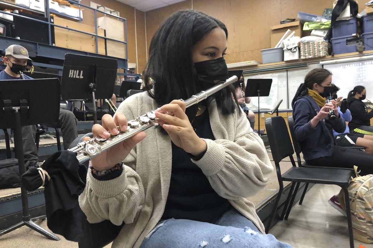A student plays the flute while wearing a protective face mask during a music class at the Sinaloa Middle School in Novato, Calif., on March 2.  (Haven Daily)