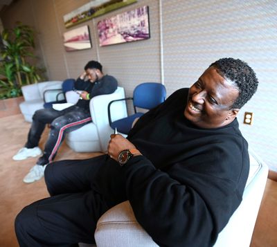 Glenn Evans, of Fort Wayne, Ind., shares a laugh before applying for a job at General Motors on May 26.  (Tribune News Service )