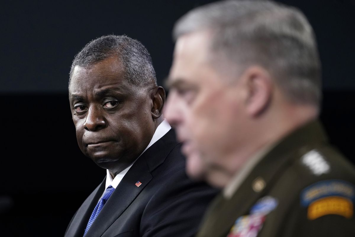 Defense Secretary Lloyd Austin, left, listens as Chairman of the Joint Chiefs of Staff Gen. Mark Milley, right, speaks during a briefing at the Pentagon in Washington, Thursday, May 6, 2021.  (Associated Press)