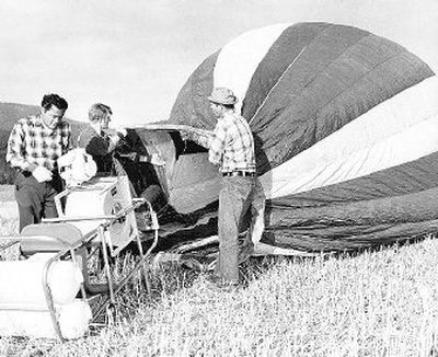 
This 1967 photo shows Mark Semich, left, a Coeur d'Alene balloon manufacturer with Arnold Holm, his assistant and balloon pilot trainee, and Albert Holm prepare a Semich-built balloon for flight at the Holms' place on Fernan Hill northeast of Coeur d'Alene. 
 (Photo archive/ / The Spokesman-Review)