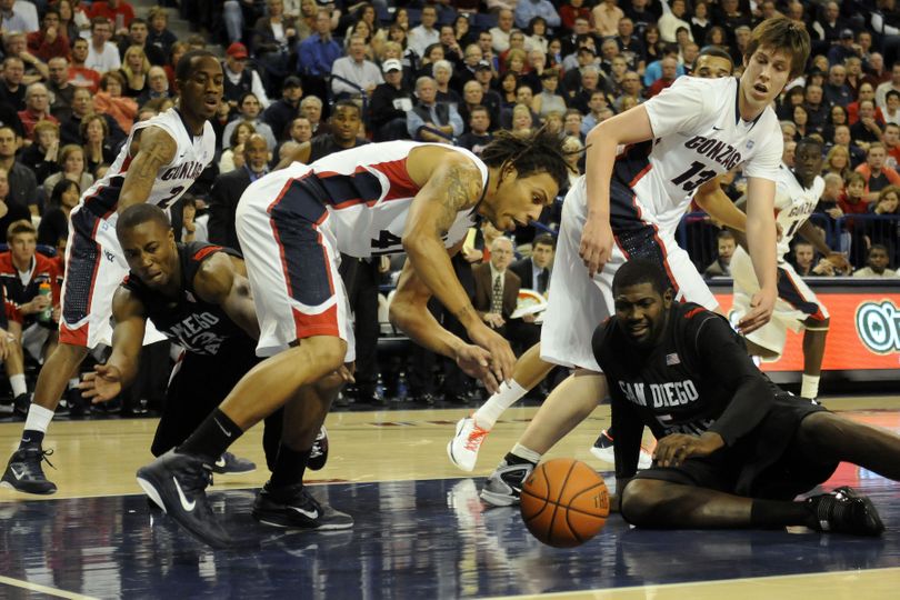 Gonzaga's Steven Gray (41) scrambles to pick up a loose ball as from left to right Gonzaga's Marquise Arop (2), San Diego St's D.J. Gay, Gonzaga's Kelly Olynk (13) and San Diego St's Brian Carwell (5) watch in the first half of an NCAA college basketball game, Tuesday, Nov. 16, 2010, in Spokane, Wash. (Jed Conklin / Fr170252 Ap)