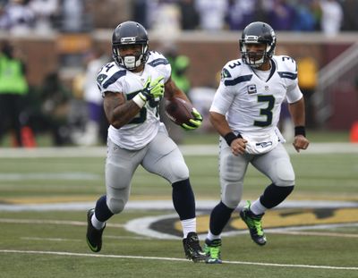 Seattle Seahawks running back Thomas Rawls, left, has been limited to 19 carries for 25 yards this season. (Jim Mone / Associated Press)