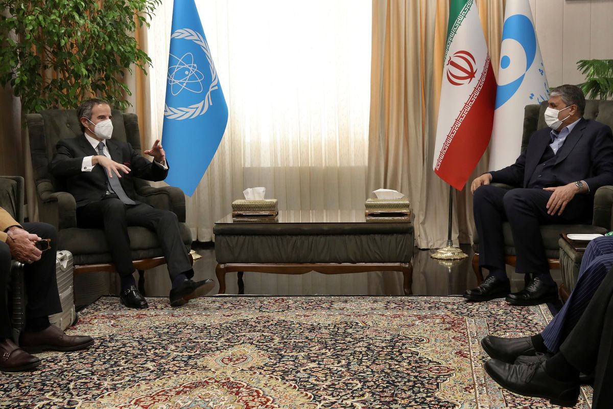 FILE - International Atomic Energy Organization, IAEA, Director General Rafael Mariano Grossi, left, speaks with Head of Atomic Energy Organization of Iran Mohammad Eslami during their meeting in Tehran, on March 5, 2022. As the war in Ukraine rages on, diplomats trying to salvage the languishing 2015 Iran nuclear deal have been forging ahead with negotiations despite distractions caused by the conflict.  (Vahid Salemi)