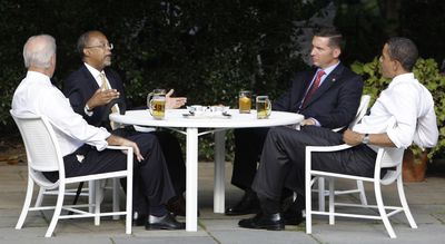 President Barack Obama, right, and Vice President Joe Biden, left, have a beer with Harvard scholar Henry Louis Gates Jr., second from left, and Cambridge, Mass., police Sgt. James Crowley in the Rose Garden  on Thursday.  (Associated Press / The Spokesman-Review)