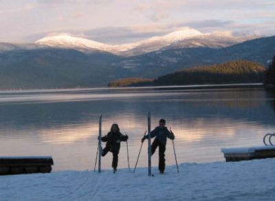 
Two skiers pause along the edge of Priest Lake at Hill's Resort. The popular spot is a summer getaway and a winter excursion starting point, drawing skiers and snowmobilers on winter weekends. 
 (Craig Hill / The Spokesman-Review)