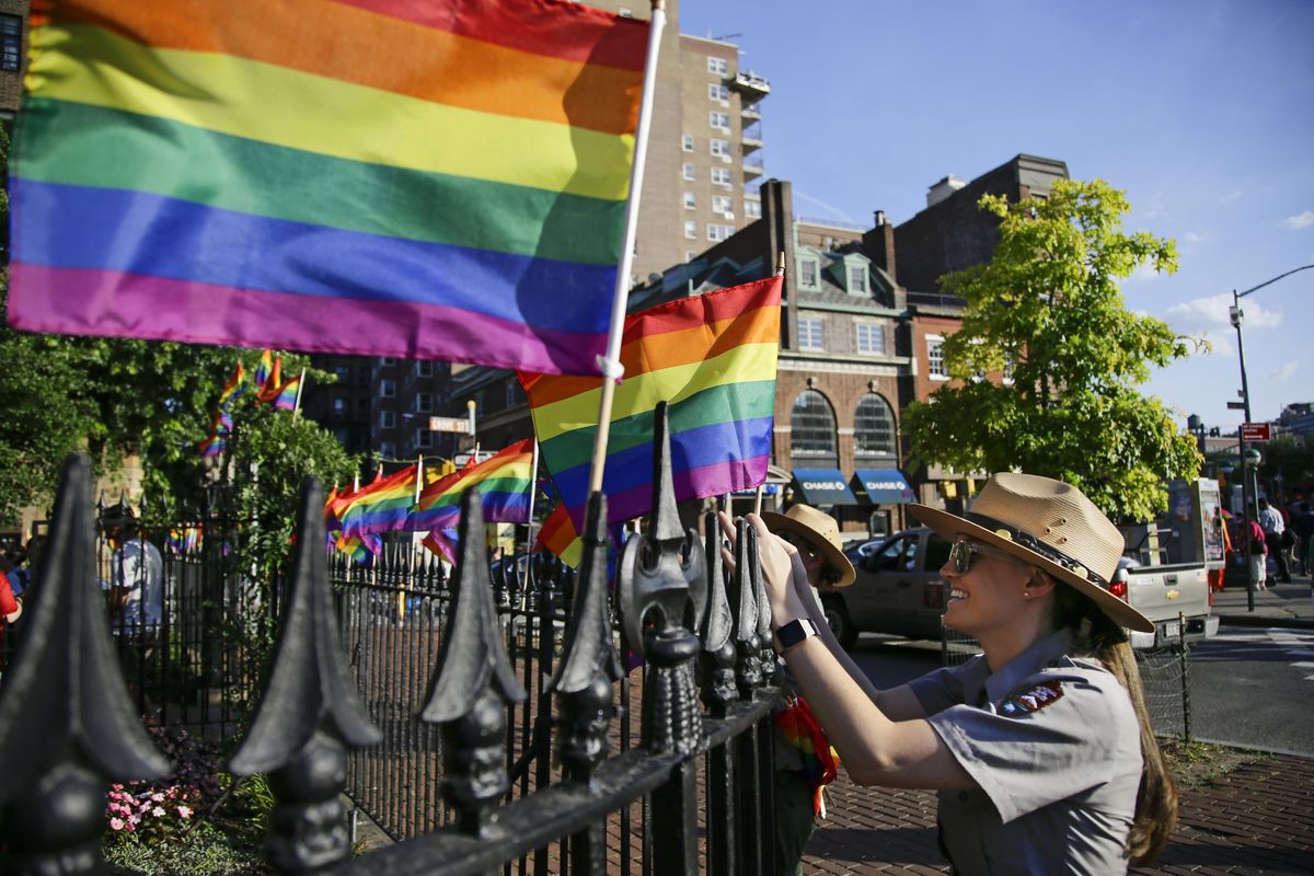 National Parks Ranger Anne Stanley places flags around the Stonewall National Monument, Thursday, June 27, 2019, in New York. (Frank Franklin II / AP)