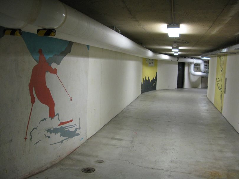 Wall paintings 30 years old and more decorate the underground tunnel between Idaho’s state Capitol and nearby state office buildings; lawmakers voted Monday to give the tunnel an art facelift. (Betsy Russell)