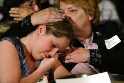 
Melissa Ielpi, left, is comforted by her mother, Anne, as they listen to testimony and see images during Sept. 11 commission hearings in New York. They lost firefighter Jonathan Ielpi, Melissa's brother and Anne's son, in the attack.Melissa Ielpi, left, is comforted by her mother, Anne, as they listen to testimony and see images during Sept. 11 commission hearings in New York. They lost firefighter Jonathan Ielpi, Melissa's brother and Anne's son, in the attack.
 (Associated PressAssociated Press / The Spokesman-Review)