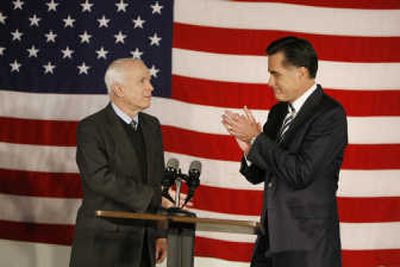 
Mitt Romne applauds as Sen. John McCain reaches out to shake hands during a news conferenceThursday in Boston.Associated Press
 (Associated Press / The Spokesman-Review)