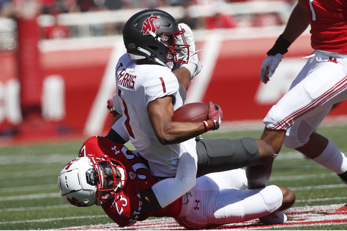 Utah cornerback Faybian Marks (23) tackles Washington State wide receiver Travell Harris (1) in the first half, of an NCAA college football game Saturday, Sept. 25, 2021, in Salt Lake City, Utah.  (Associated Press)