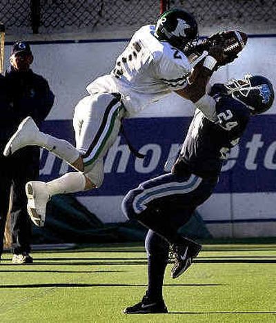 
Gonzaga Prep's Brandon Kennedy pulls in a first-half catch against Kentwood's Jameson Lange on Saturday at Albi Stadium.
 (Brian Plonka / The Spokesman-Review)