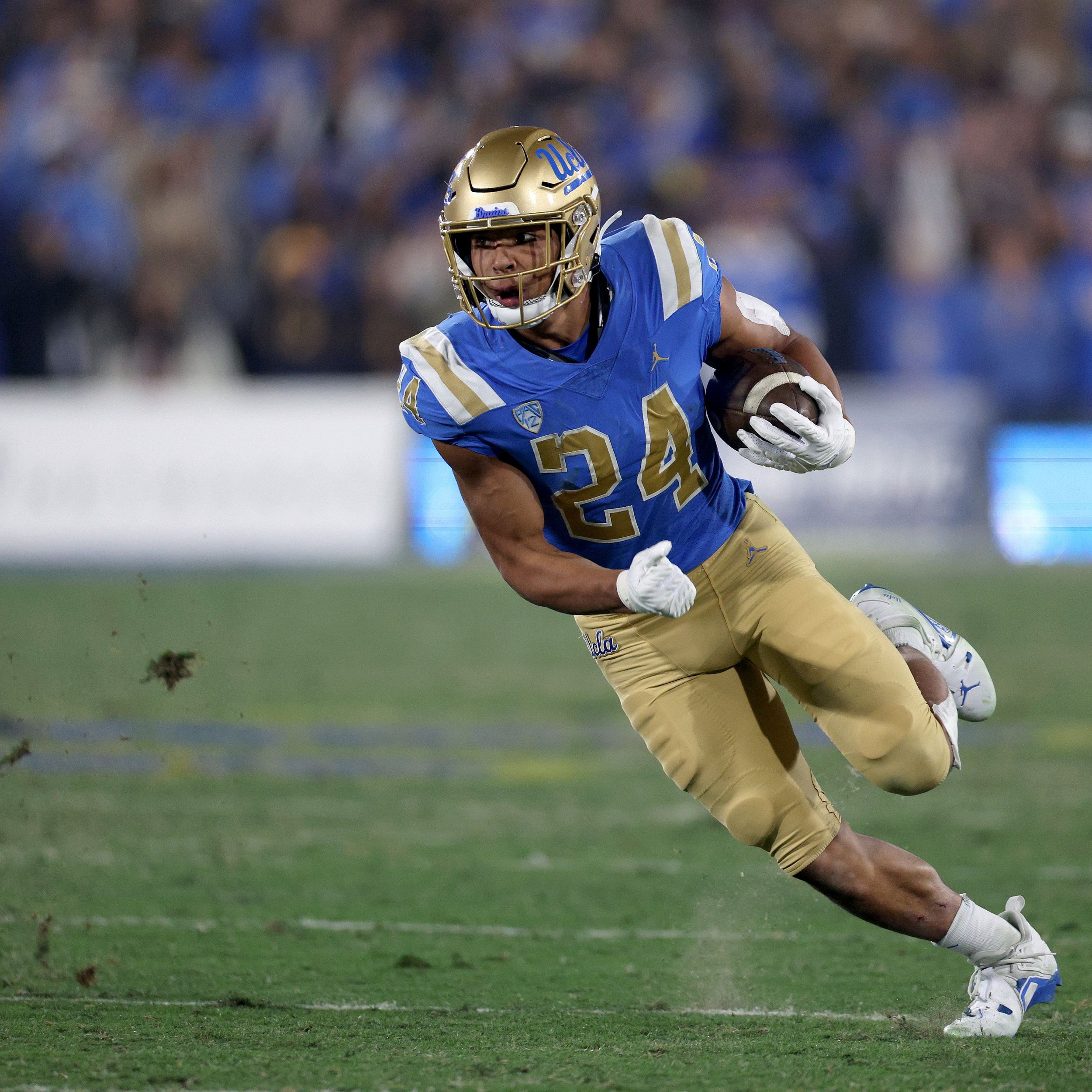 Seattle Seahawks running back Zach Charbonnet carries the ball