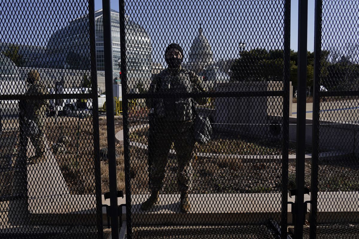 National Guard stand guard at a perimeter fence at the Capitol in Washington, Thursday, March 4, 2021.  (Carolyn Kaster)