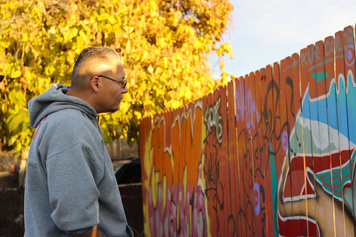 Evaristo Salas, a Sunnyside resident who won a seat on the Sunnyside School Board, is working on a mural project where he hopes to tell a story about history through Aztec and Mayan traditional art. The murals he’s set on redoing right now have gang graffiti. He’s working on the project alongside Chase Reiff, a local artist, and his wife, Perla Clara. (Monica Carrillo-Casas/The Spokesman-Review)