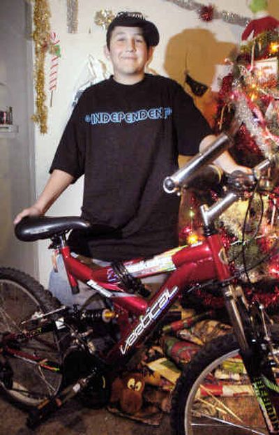 Matt Brooks stands with his new bike Thursday in Boise.
(Associated Press / The Spokesman-Review)