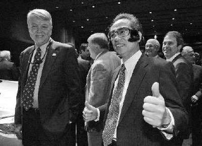 
Seiichi Sudo, right, president and COO of Toyota Motor Engineering and Manufacturing North America, wears Elvis glasses and sideburns after Toyota officially announced Tuesday that Tupelo Miss., will be the home of it's new Toyota Highlander production plant
 (Associated Press / The Spokesman-Review)