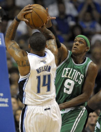 Boston’s Rajon Rondo defends Orlando’s Jameer Nelson, who scored 24 points in the Magic’s victory in Game 5.  (Associated Press)