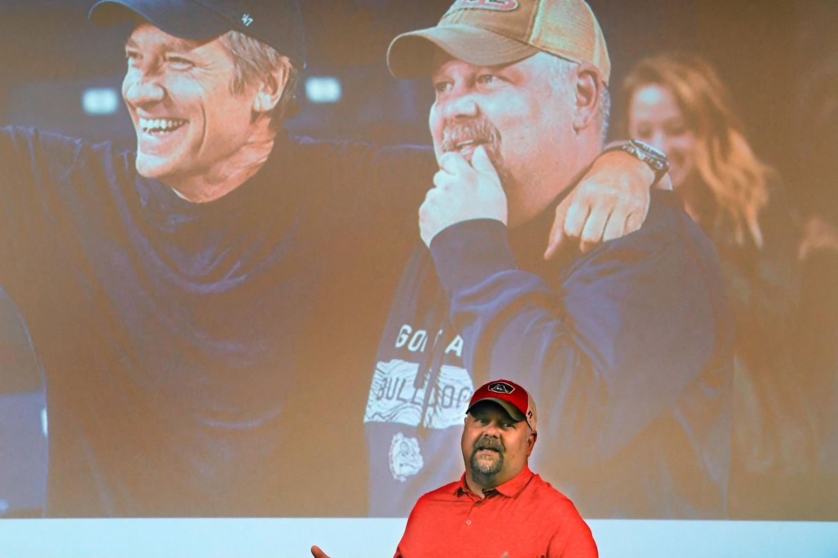 Rick Clark talks on the Gonzaga campus, Tuesday, July 9, 2019, about his experience of being featured with TV host Mike Rowe in the “Returning the Favor” show, pictured top left. Clark was featured for his nonprofit, Giving Back Packs, that gives supplies and resources to homeless people in Spokane. (Dan Pelle / The Spokesman-Review)