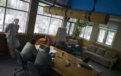 
Cyan Worlds co-founder Rand Miller, at far left, participates in a teleconference with several of the business ventures helping to launch the new version of the online game Uru Live at the company's Spokane headquarters last week. 
 (PHOTOS BY Christopher Anderson / The Spokesman-Review)