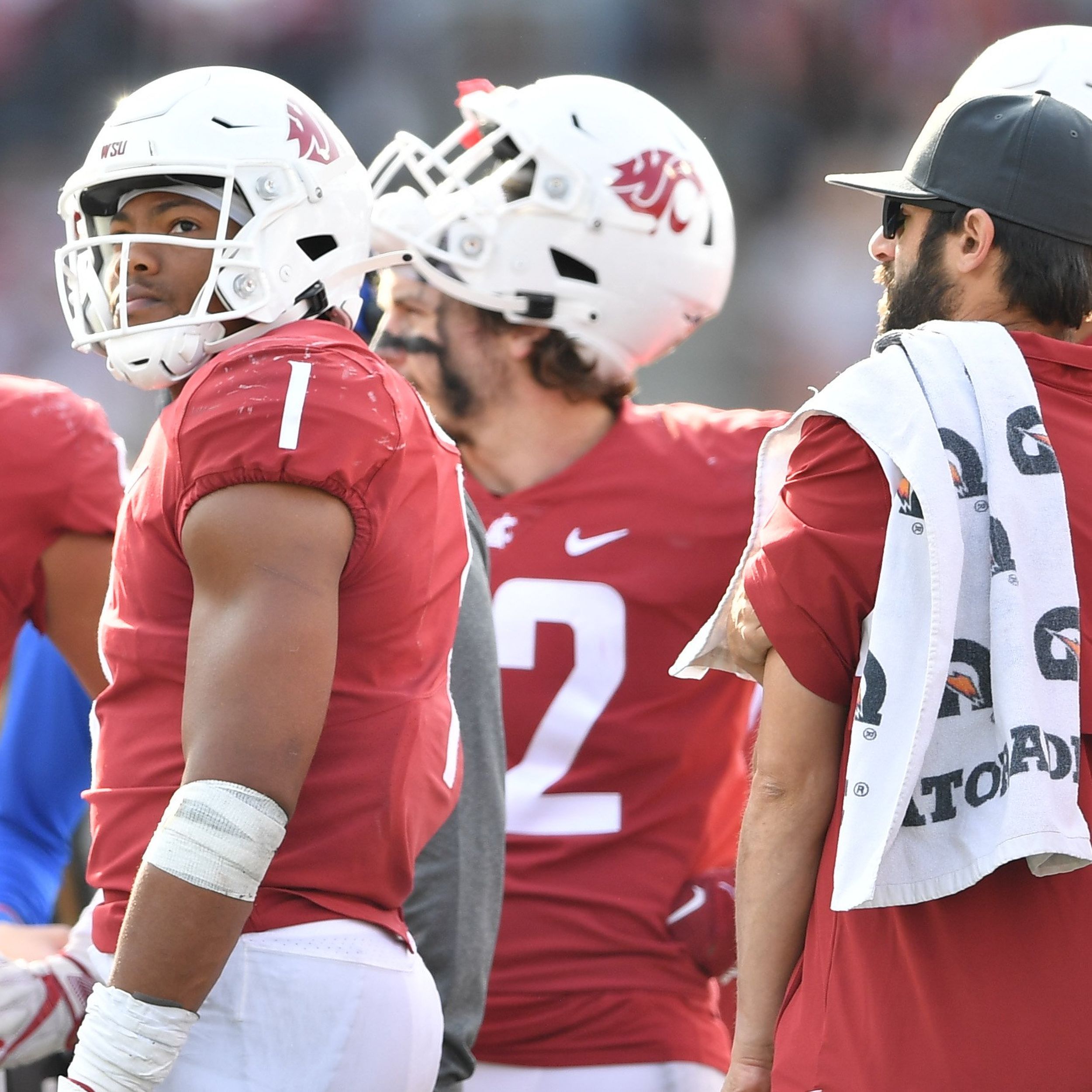 Washington State linebacker Daiyan Henley looks to the sideline