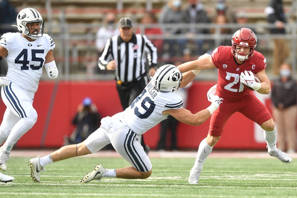 Washington State Cougars running back Max Borghi (21) runs the ball against the Brigham Young Cougars during the first half of a college football game on Saturday, Oct 23, 2021, on Gesa Field in Martin Stadium in Pullman, Wash.  (Tyler Tjomsland/The Spokesman-Review)