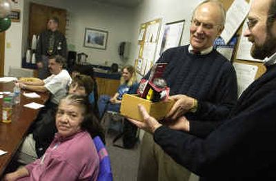 Ken Korczyk, right, chief executive officer of TESH, presents Sen. Larry Craig with some flashlights built by disabled people in an Idaho Falls workshop similar to the one that TESH operates. Korczyk wanted to impress on the senator the importance of his company's work with disabled people in Coeur d'Alene on Thursday. 
 (Jesse Tinsley / The Spokesman-Review)