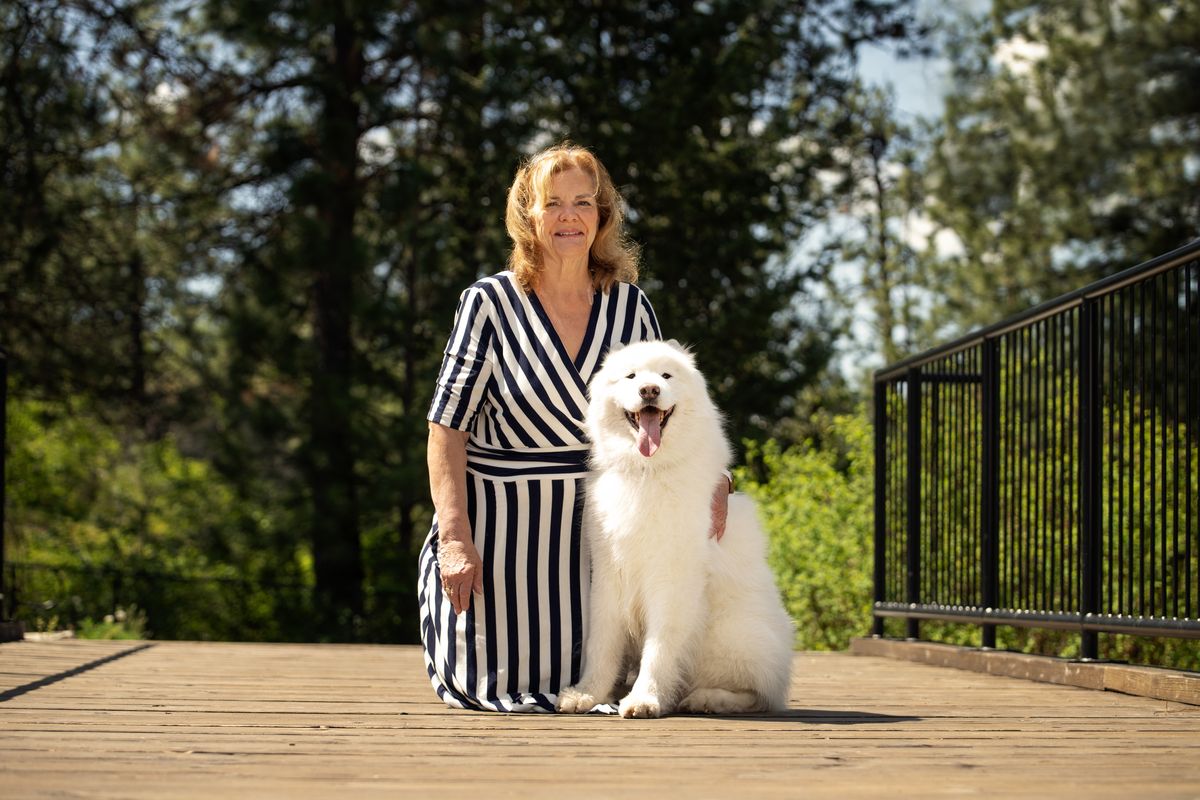 Cheri Hollenback poses with her Samoyed, Kihei. Hollenback is one of six judges at the Spokane Valley Sieger this weekend.  (Angela Schneider/Special to The Spokesman-Review)