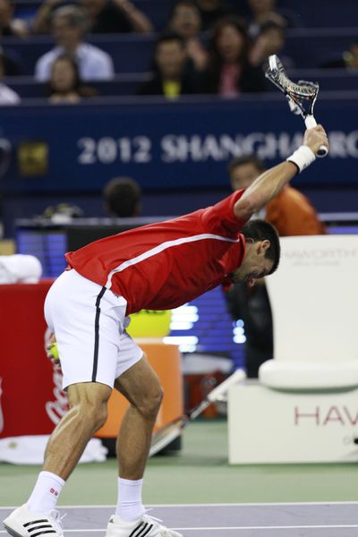 Novak Djokovic lets out some early frustration during his comback victory over Andy Murray in the Shangahi Masters final. (Associated Press)