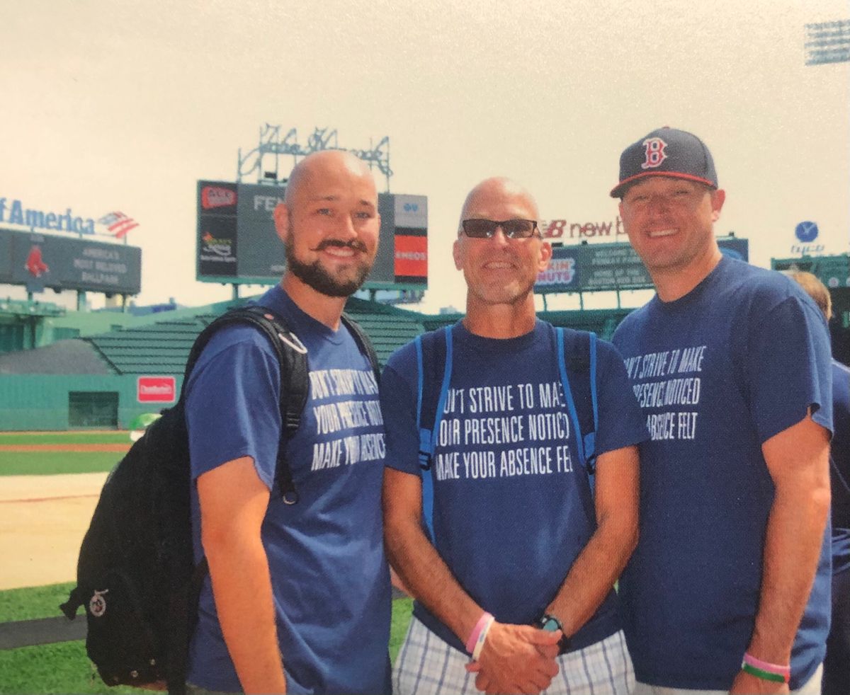John Oakley, center, poses with sons Aaron (left) and Adam at Fenway Park in Boston, Massachusetts, during a “bucket list” trip in summer 2015.  (Courtesy Oakley family)