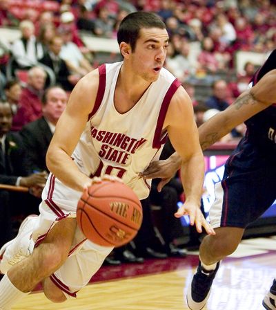 Taylor Rochestie is making less than 35 percent of his shots for the Cougars this season. (Associated Press / The Spokesman-Review)