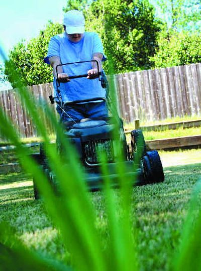 
Mowing at the correct height and using your clippings can help your lawn look lush and green.
 (Metro Services / The Spokesman-Review)